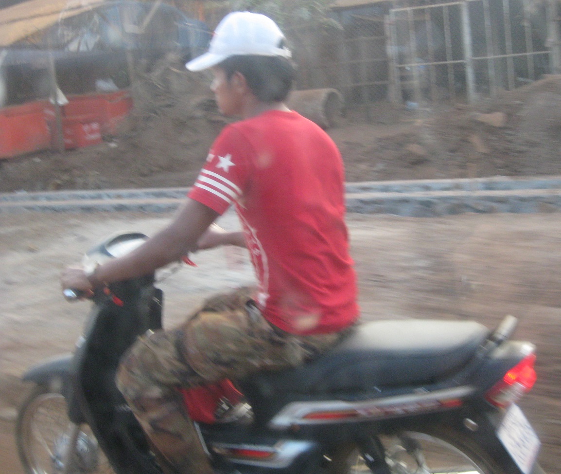 Cambodian Guy on a Moto